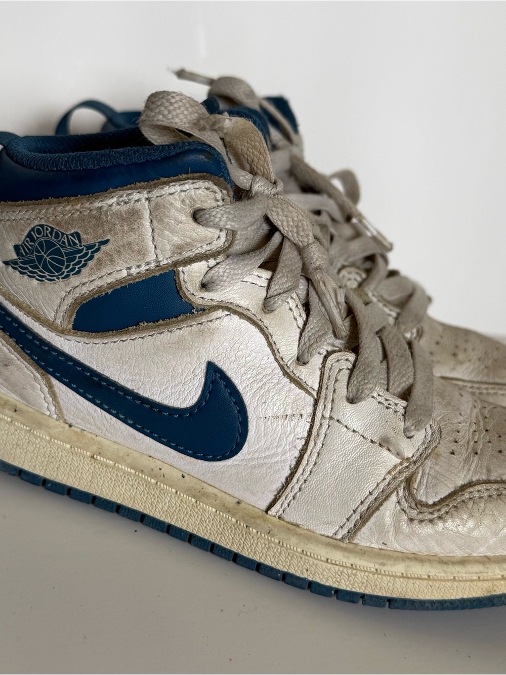 Air Jordan 1 Mid White and Navy Sneakers